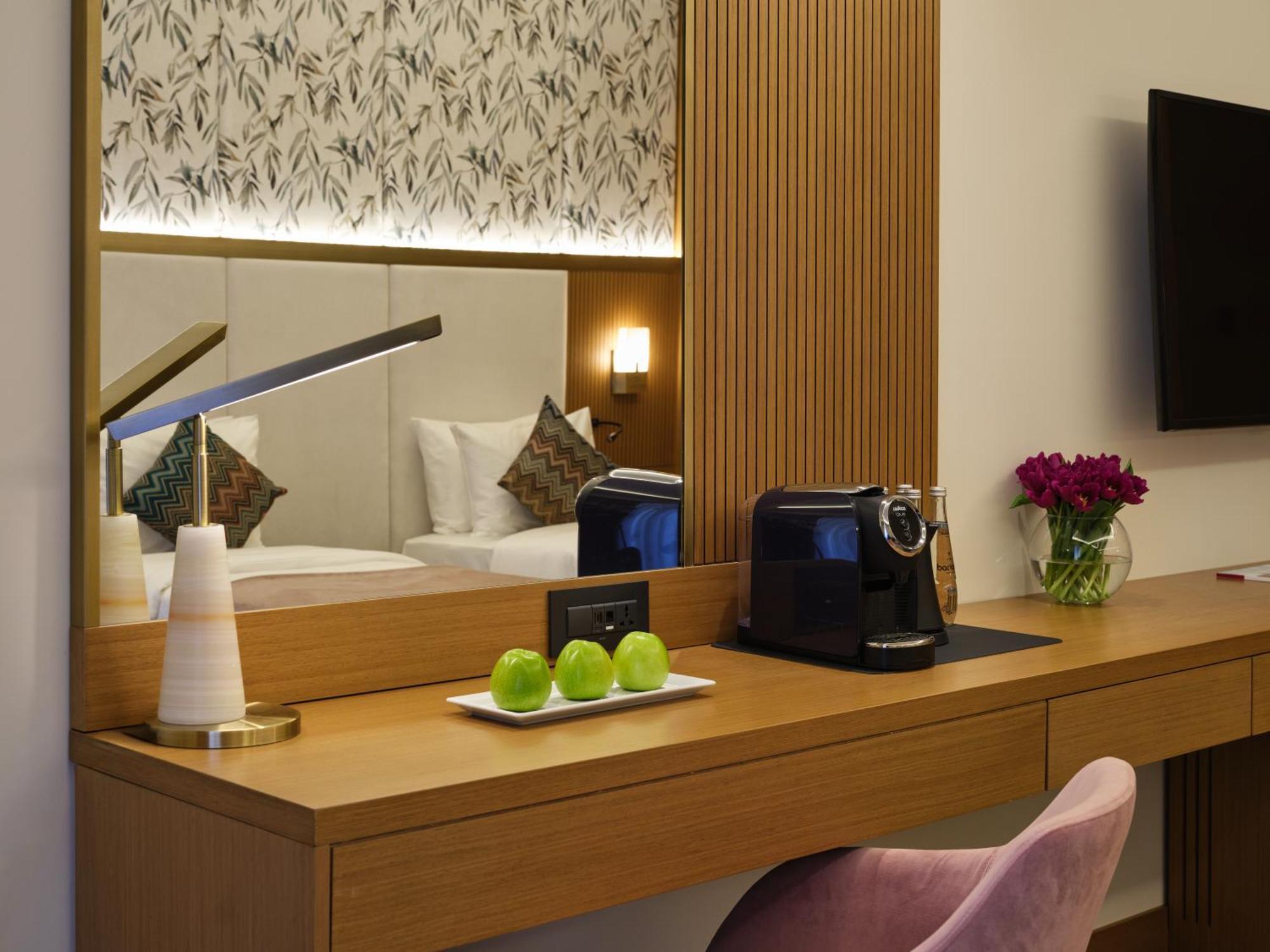 Qafqaz Riverside Hotel Gabala Buitenkant foto A Nespresso machine in a hotel room