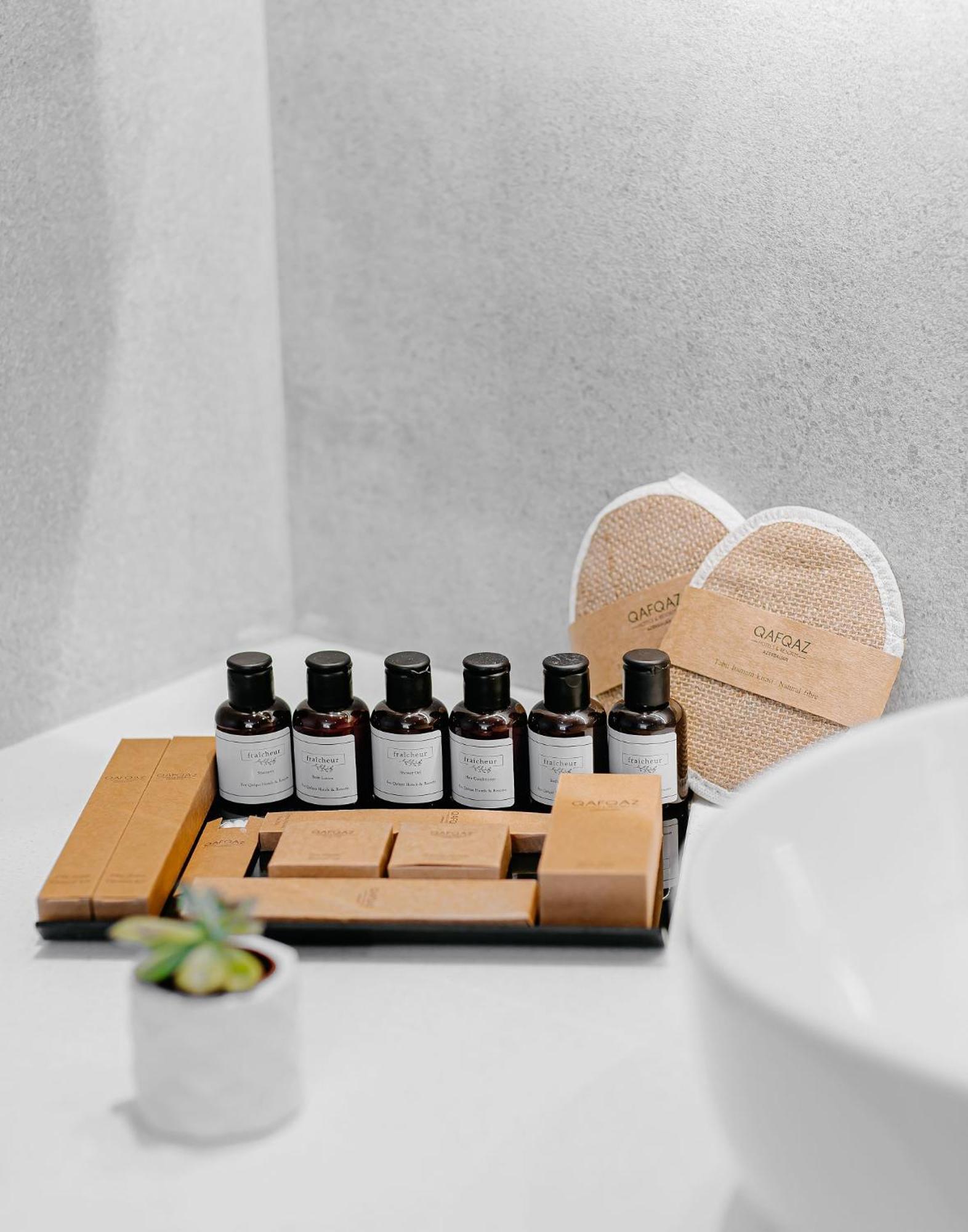 Qafqaz Riverside Hotel Gabala Buitenkant foto A selection of amenities by the brand